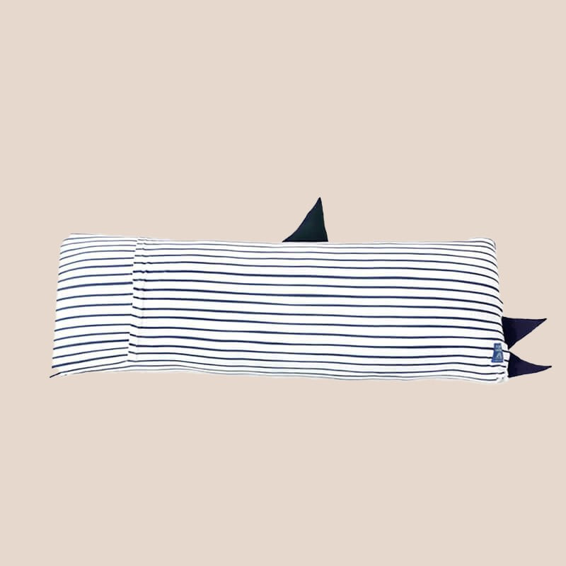 The back of a kids' bamboo pillow with a navy shark design in large by Le Petit Society.