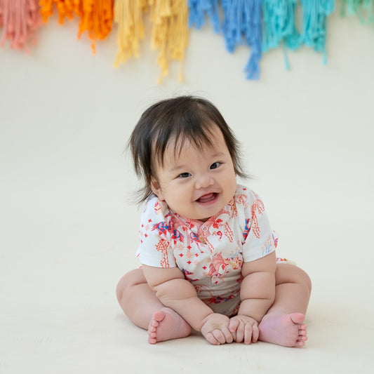 Zodiac Series - Baby Boy Jersey Romper in Red Carnival Horse Print by Le Petit Society — image 2