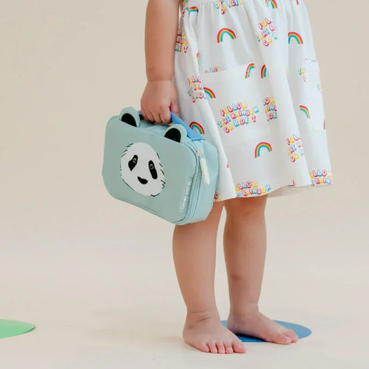 A toddler carrying a mint blue pencil case and pouch with a panda print and a pair of ears.