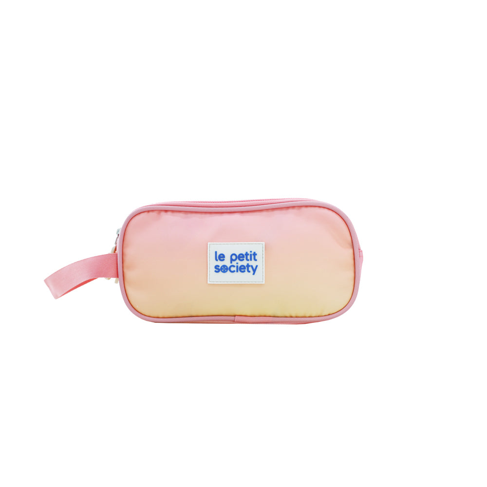 A pencil case in a pink and yellow ombre.