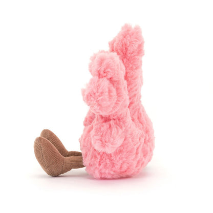 A side view of a soft pink plush coral toy  with textured branches and brown corduroy feet