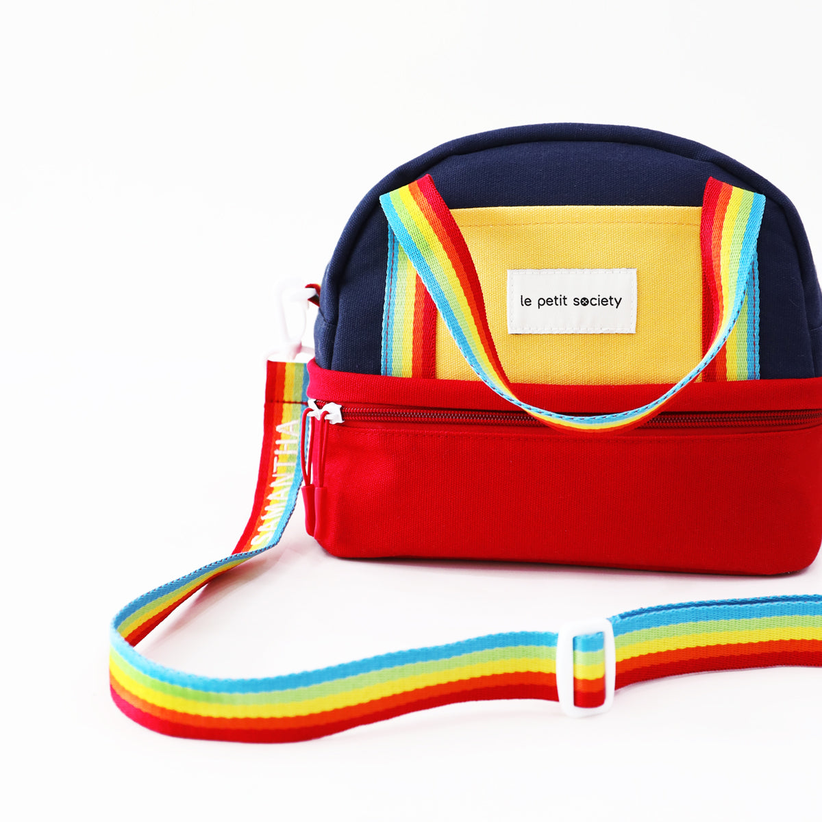 Le Petit Society's kid's thermal lunch bag with a colour block design and a rainbow strap personalised with name embroidery. 