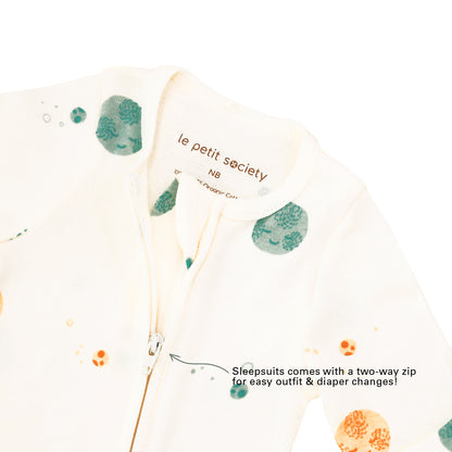 Infographic featuring the sleeves of Le Petit Society's organic baby sleepsuit, which can be folded to replace mittens and are available on newborn, 1-3M and 3-6M sizes.