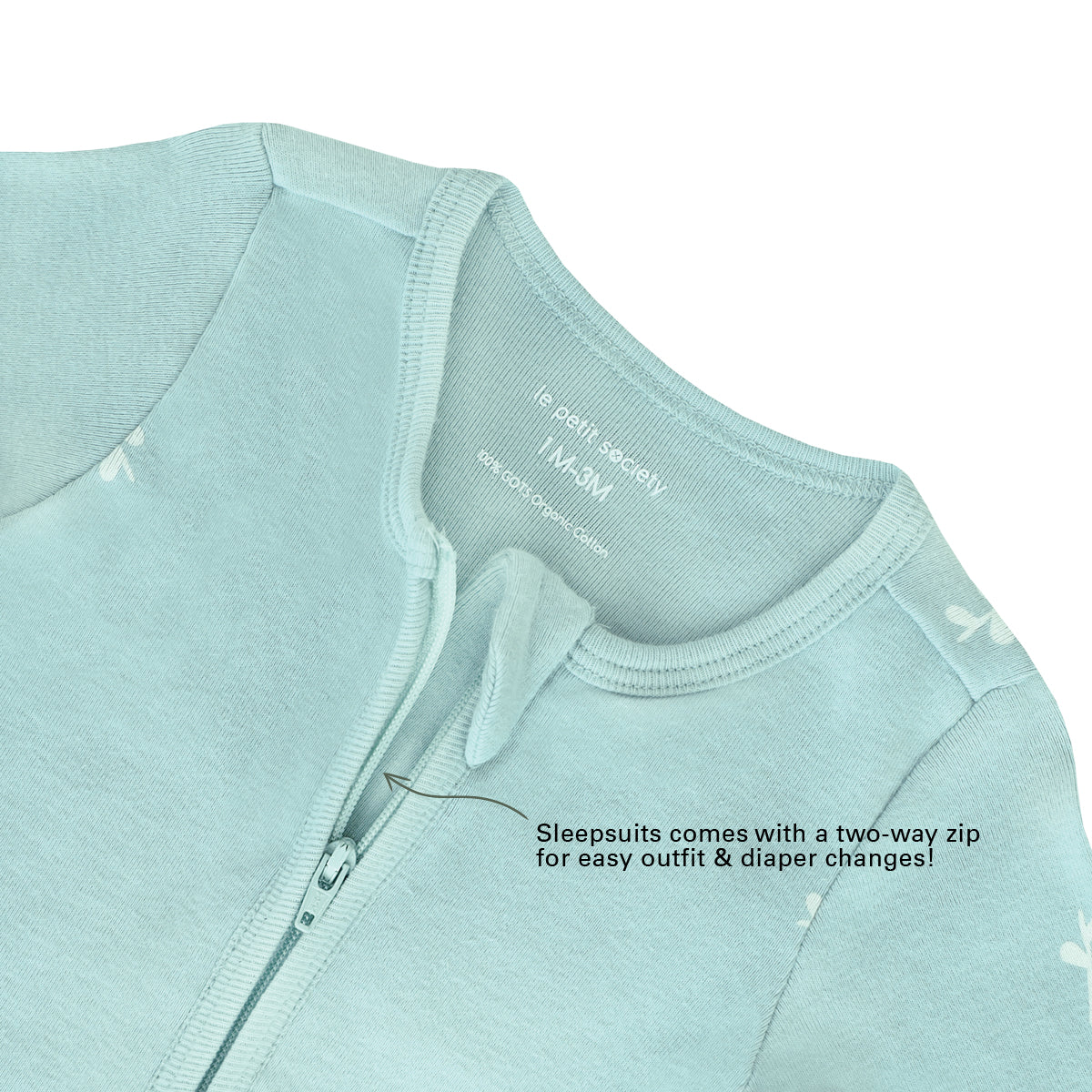 An infographic demonstrating the two-way zipper of a mint blue baby zip sleepsuit, and its function of providing an easy access to outfit and diaper changes.