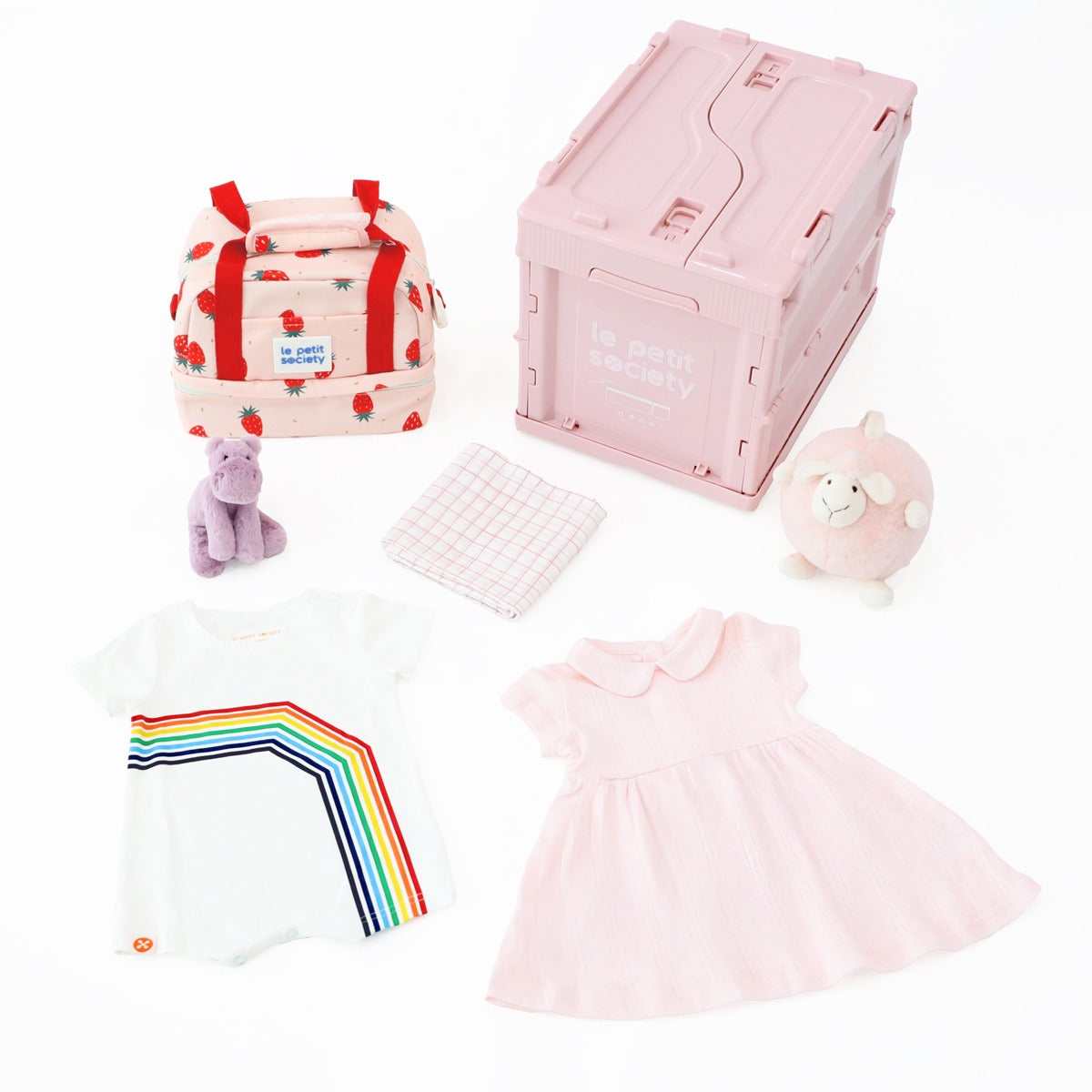 Le Petit Society's pink baby girl gift hamper containing a pink baby dress, white romper in rainbow print,  organic swaddle, pink animal plush dolls, thermal lunch bag and a collapsible storage crate.