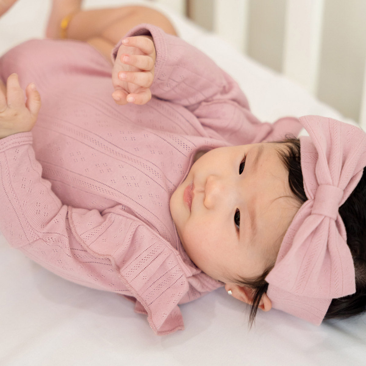 Baby Girl Long Sleeve Ruffle Romper in Plum Pointelle Cotton by Le Petit Society — image 3