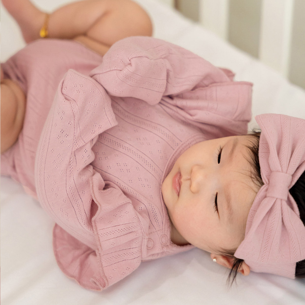 Baby Girl Long Sleeve Ruffle Romper in Plum Pointelle Cotton by Le Petit Society — image 6