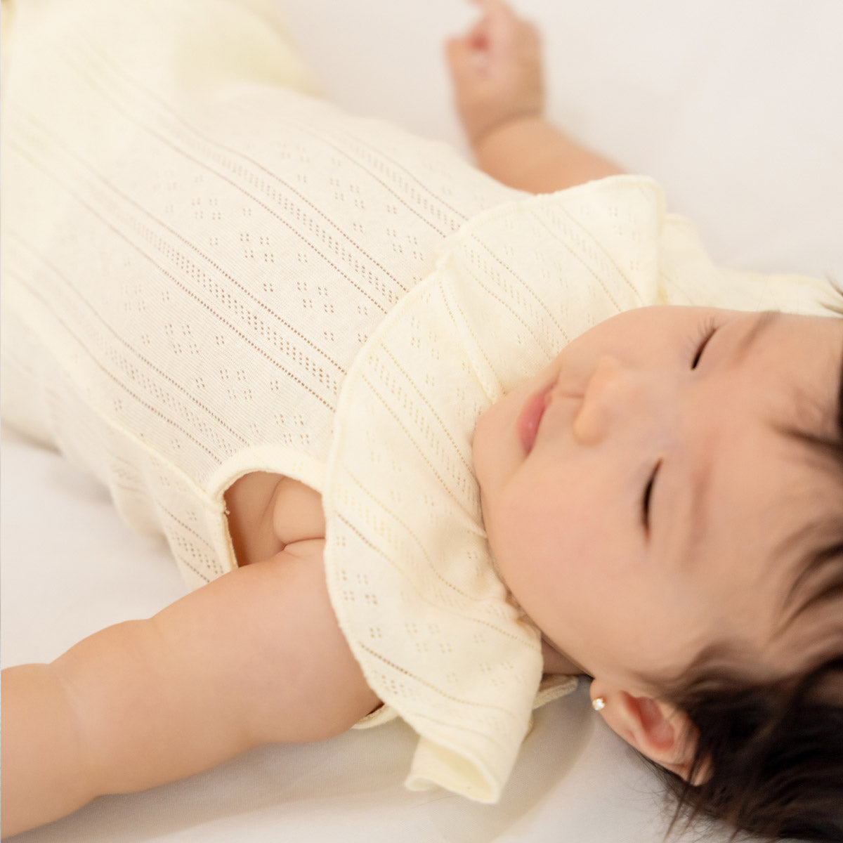 Baby Girl Ruffle Romper in Cream Pointelle Cotton by Le Petit Society — image 2