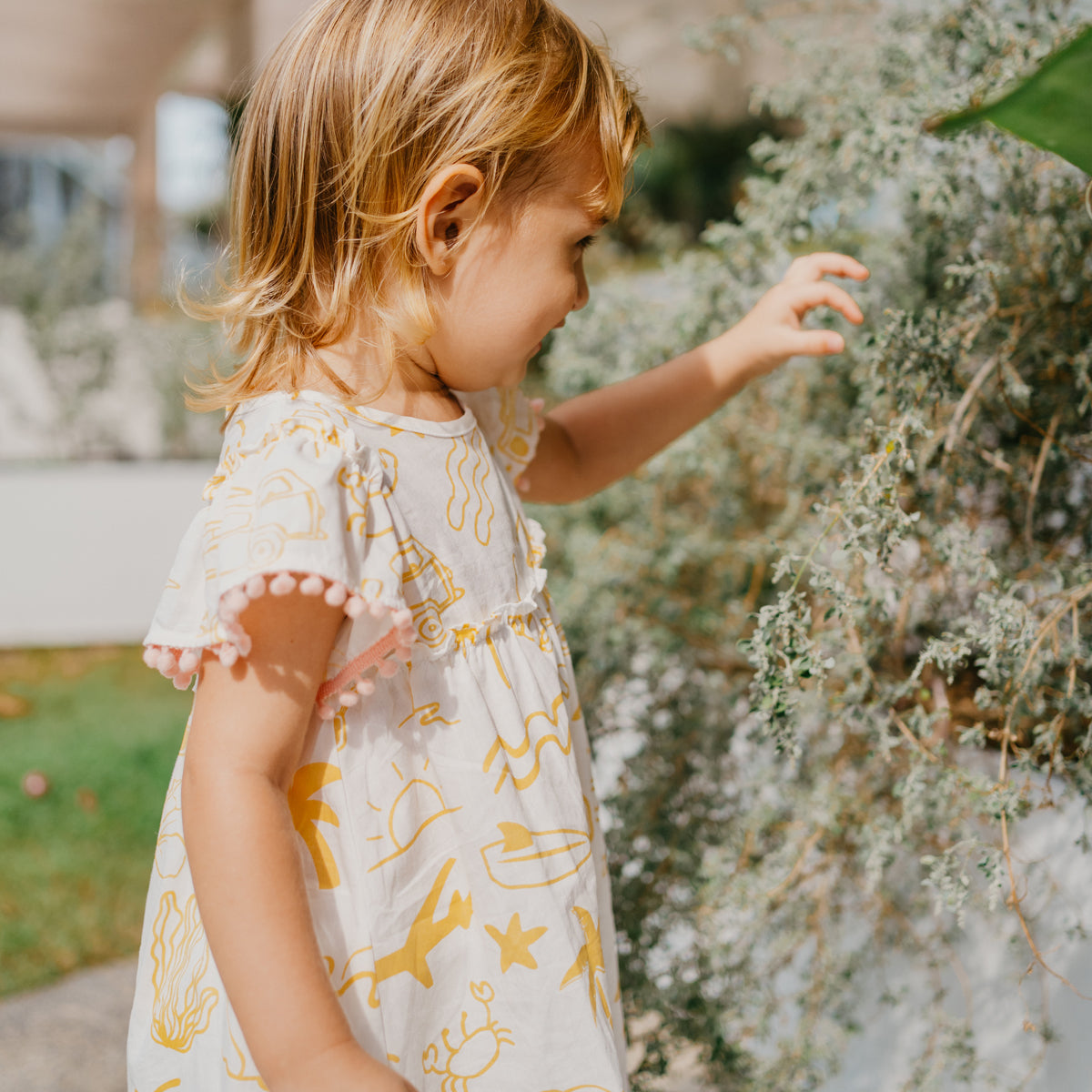 Resort Series - Baby Girl Flutter Sleeves Baby Doll Dress in Island Print by Le Petit Society — image 7
