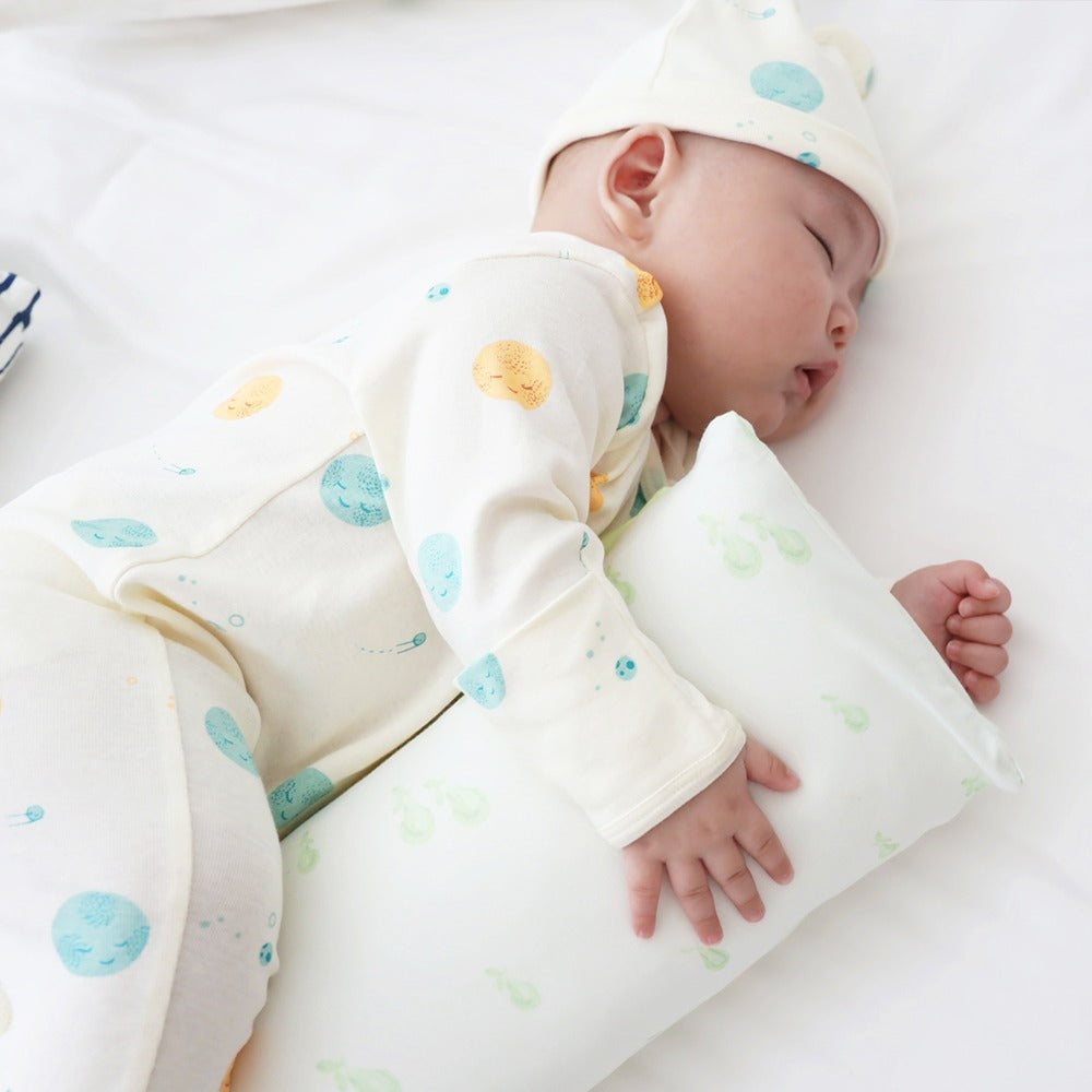 A kids' pillow in size mini with a print of green pears, from Le Petit Society.
