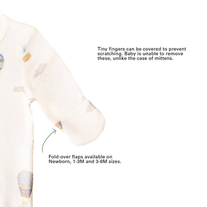 An infographic showing the mittens of an organic baby zip sleepsuit, which come with fold over flaps to cover a baby's hands and keep them warm.
