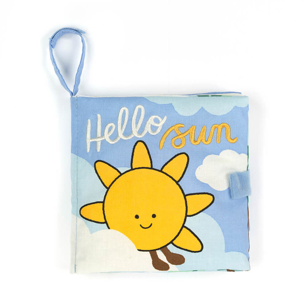 This is the soft fabric baby book titled "Hello Sun", featuring a smiling sun and embroidered title on a blue sky background