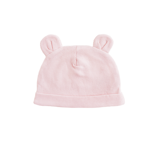 An organic baby bear hat in pink by Le Petit Society.
