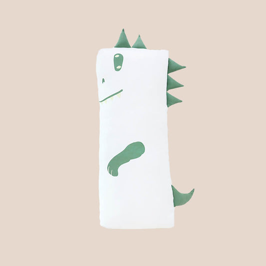 A kids' bamboo pillow with a green dinosaur design in medium by Le Petit Society.