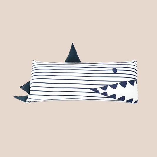 A kids' bamboo pillow with a navy shark design in medium by Le Petit Society.