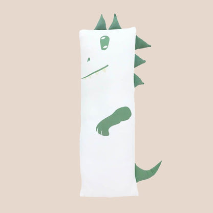 A kids' bamboo pillow with a green dinosaur design in large by Le Petit Society.