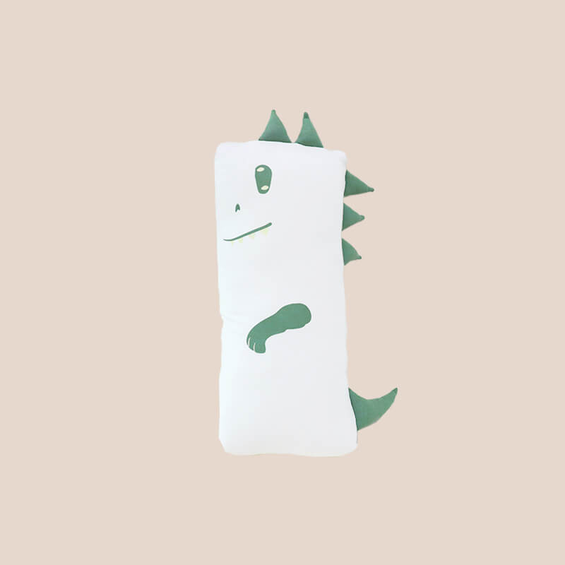A kids' bamboo pillow with a green dinosaur design in mini by Le Petit Society.