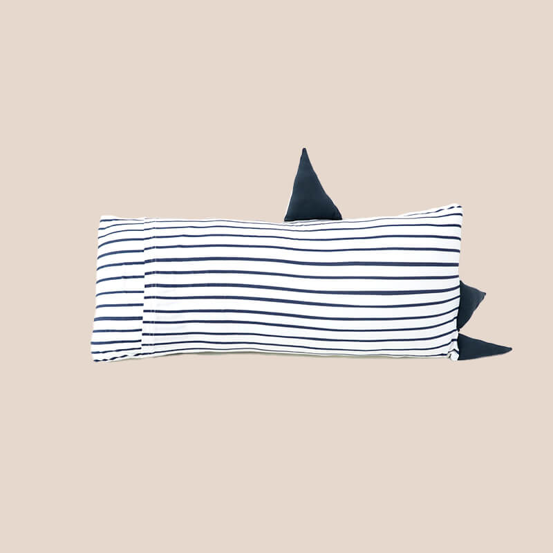 The back of a kids' bamboo pillow with a navy shark design in medium by Le Petit Society.