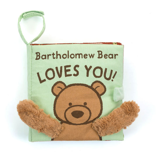 A soft fabric baby book with a bear on the cover and fuzzy brown arms, titled "Bartholomew Bear LOVES YOU!"