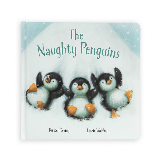 Front cover of the children's book The Naughty Penguins by Kirsten Irving and Lizzie Walkley, featuring three playful penguin chicks lying in the snow with happy expressions and their flippers raised. The background shows a snowy, pale blue sky with snowf