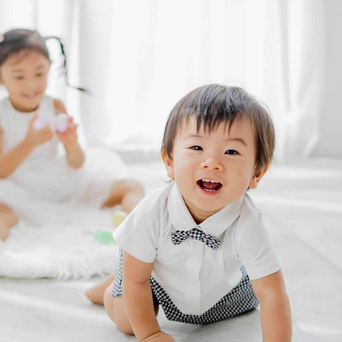 Papa & Mini - Baby Boy Bow Tie Romper in Black Gingham by Le Petit Society — image 2