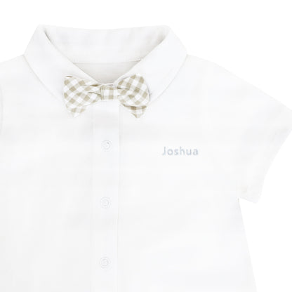 A baby boy bow tie romper with a beige gingham print and a name embroidery personalisation on the left chest.