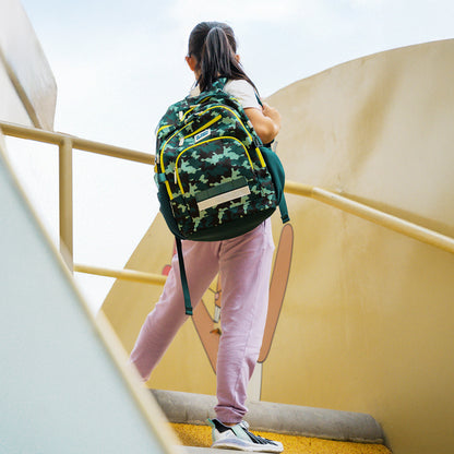 A primary school carrying the LPS kids double pocket school bag in camouflage print.