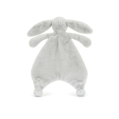 A back view of a silver plush bunny comforter with long floppy ears, stitched facial features, and a flat blanket-style body with lightly padded arms and feet, positioned standing against a white background.
