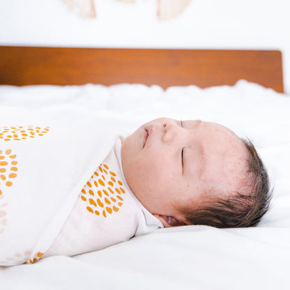 Baby Organic Swaddle in Dandelion Print by Le Petit Society