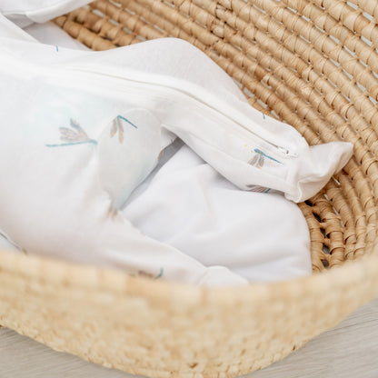 A close-up of the two-way zip that extends to the feet of Le Petit Society's organic zip sleepsuit in dragonfly print. 