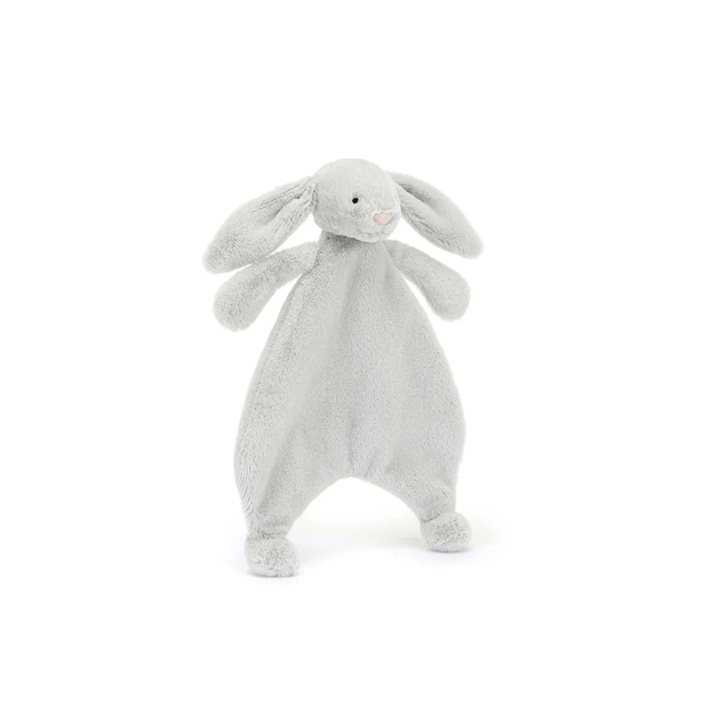A front view of a grey plush bunny comforter with long floppy ears, stitched facial features, and a flat blanket-style body with lightly padded arms and feet, positioned standing against a white background.