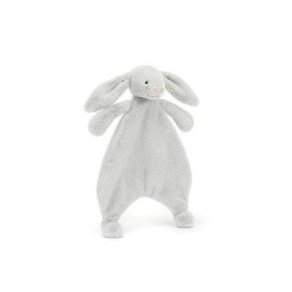 A front view of a grey plush bunny comforter with long floppy ears, stitched facial features, and a flat blanket-style body with lightly padded arms and feet, positioned standing against a white background.