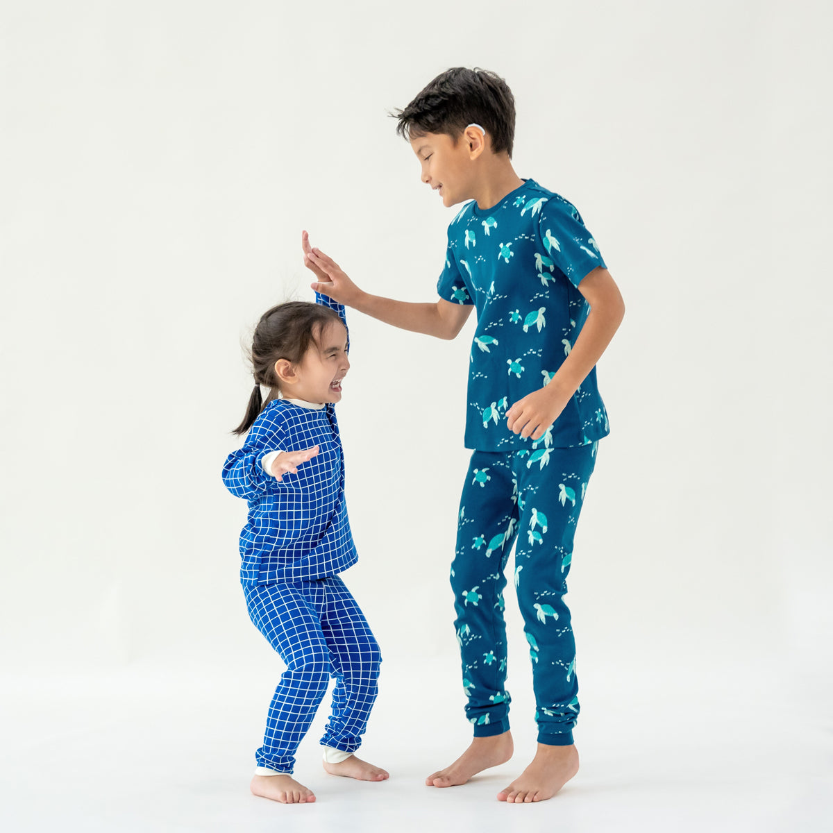 Kids Long Sleeve Organic Pyjamas Set in Grid Print by Le Petit Society — image 2