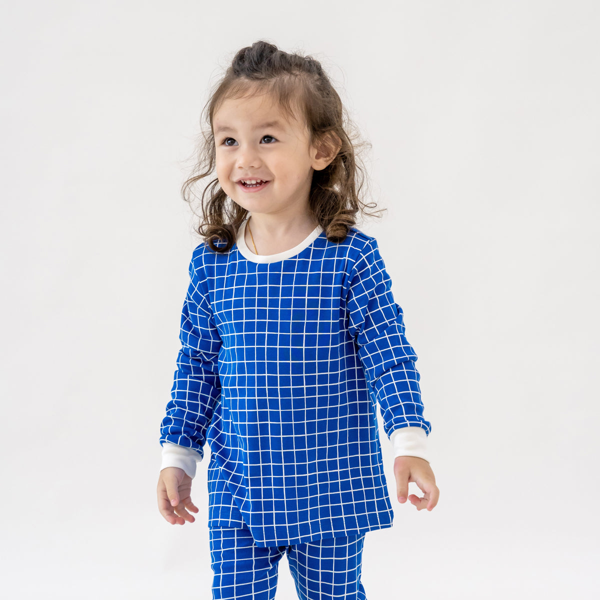 Kids Long Sleeve Organic Pyjamas Set in Grid Print by Le Petit Society — image 5