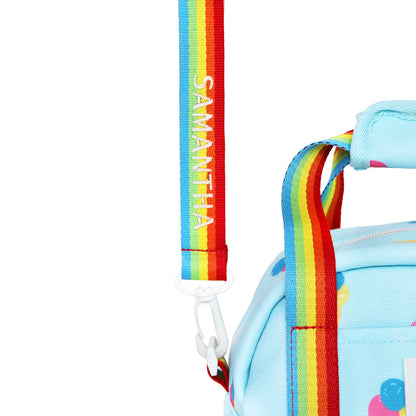 A close-up of a personalised name embroidery on a rainbow bag strap of Le Petit Society's thermal lunch bag.