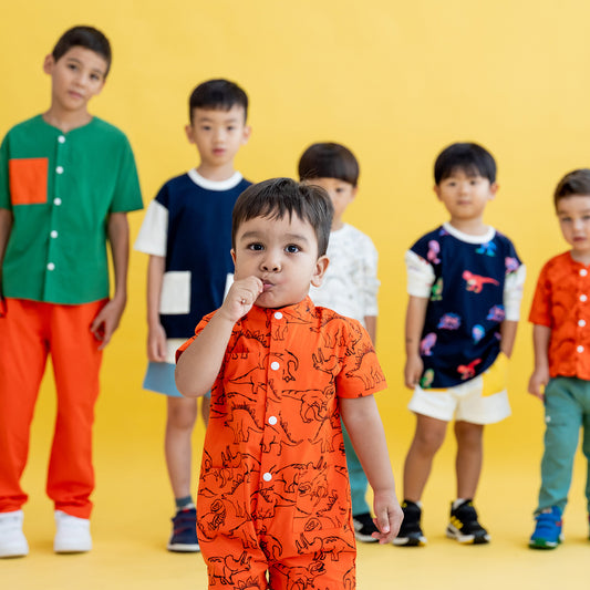 Made for Play - Kids Playsuit in Dino Sketch Print in Orange by Le Petit Society