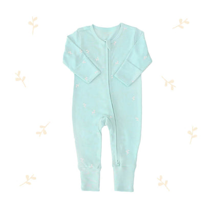 An organic baby zip sleepsuit from Le Petit Society. It is mint blue in colour, with a print of leaves and foldable mittens and footies.