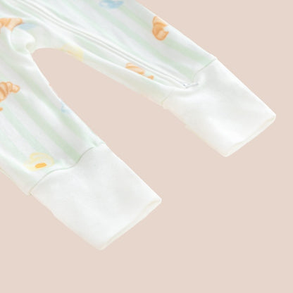 A close-up of the footies of a baby sleepsuit by Le Petit Society.