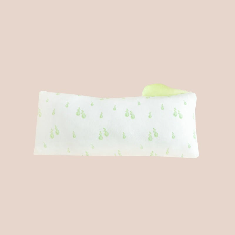 A kids' pillow in size medium with a print of green pears, from Le Petit Society.