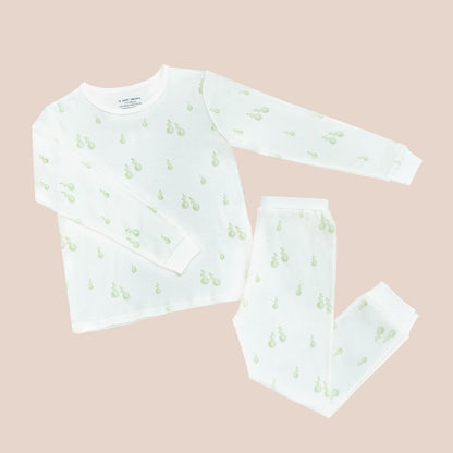 A kids pyjamas set from Le Petit Society, featuring a soft bamboo fabric and a print of green pears.