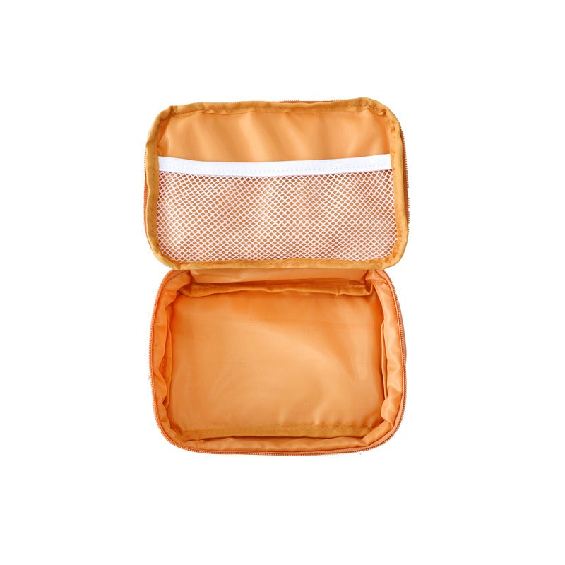 An inner view of an orange pencil case.