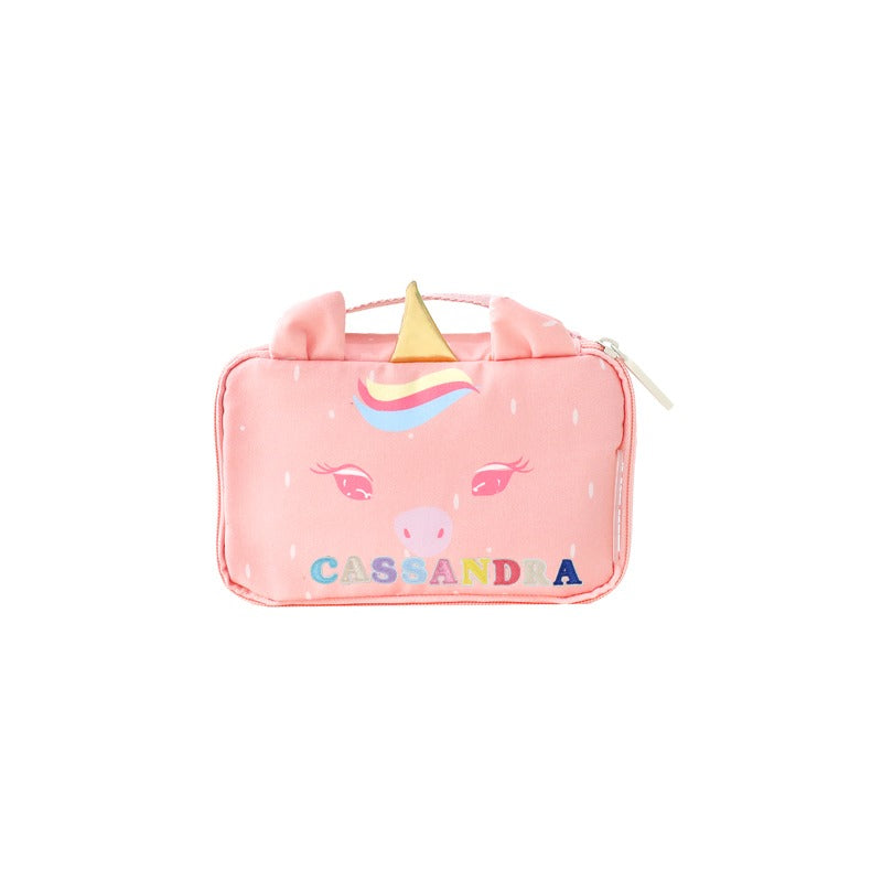 A pink unicorn pencil case with personalised name patches.