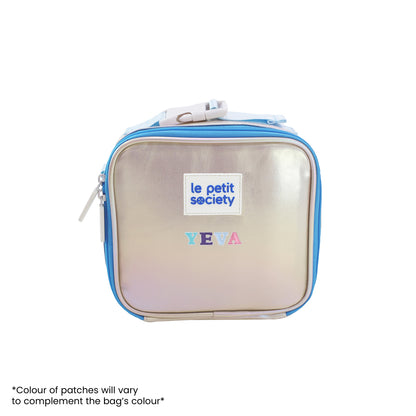 An iridescent blue and silver thermal lunch bag personalised with name patches.