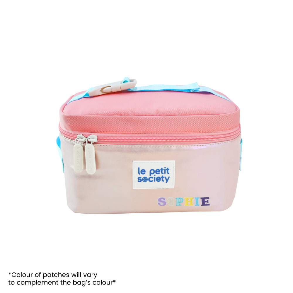 An iridescent pink thermal lunch bag with personalised name patches.