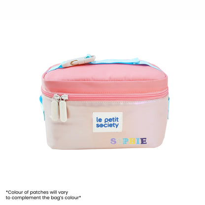 An iridescent pink thermal lunch bag with personalised name patches.