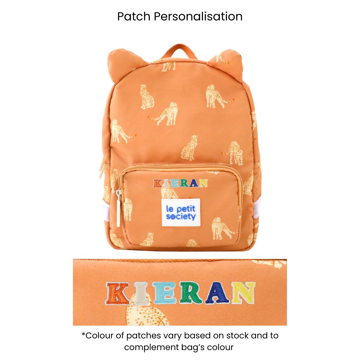 An orange preschool bag with a leopard print and personalised name patches.