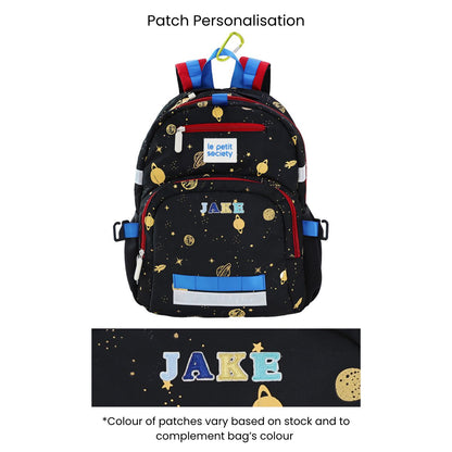 The LPS kids single pocket school bag in planets print with red and blue accents, and personalised name patches.