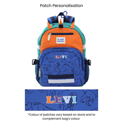 The LPS kids single pocket school bag with a dinosaur print and personalised name patches.