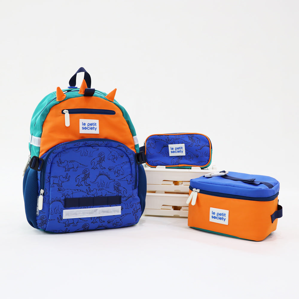 The LPS Kids Essential School Bundle in a blue and orange dinosaur design, comes with a single pocket school bag, pencil case and lunch bag.