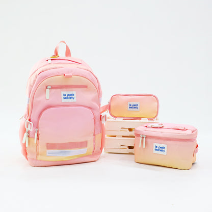 The LPS Kids Essential School Bundle in pink and yellow ombre, consisting of a double pocket school bag, pencil case and lunch bag.